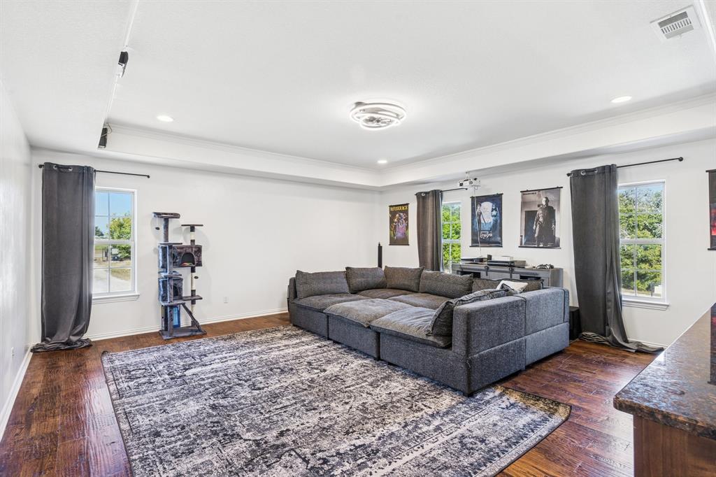 3390 Zion Hill Road Weatherford, TX 76088 - Photo 19 of 40 a living room with furniture and a wooden floor