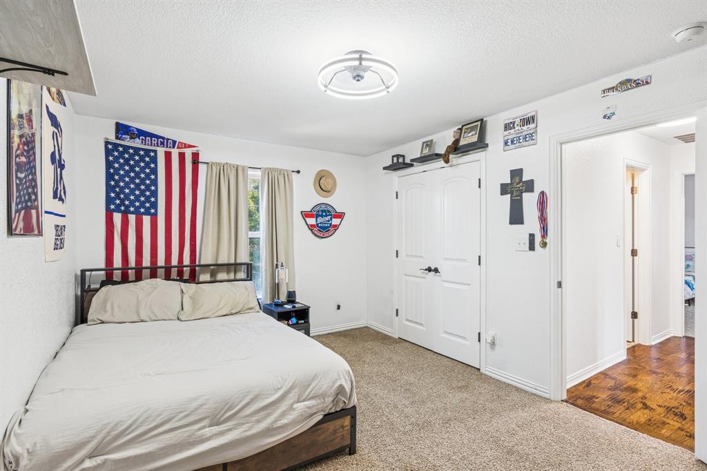 3390 Zion Hill Road Weatherford, TX 76088 - Photo 27 of 40 a bedroom with a bed and a window