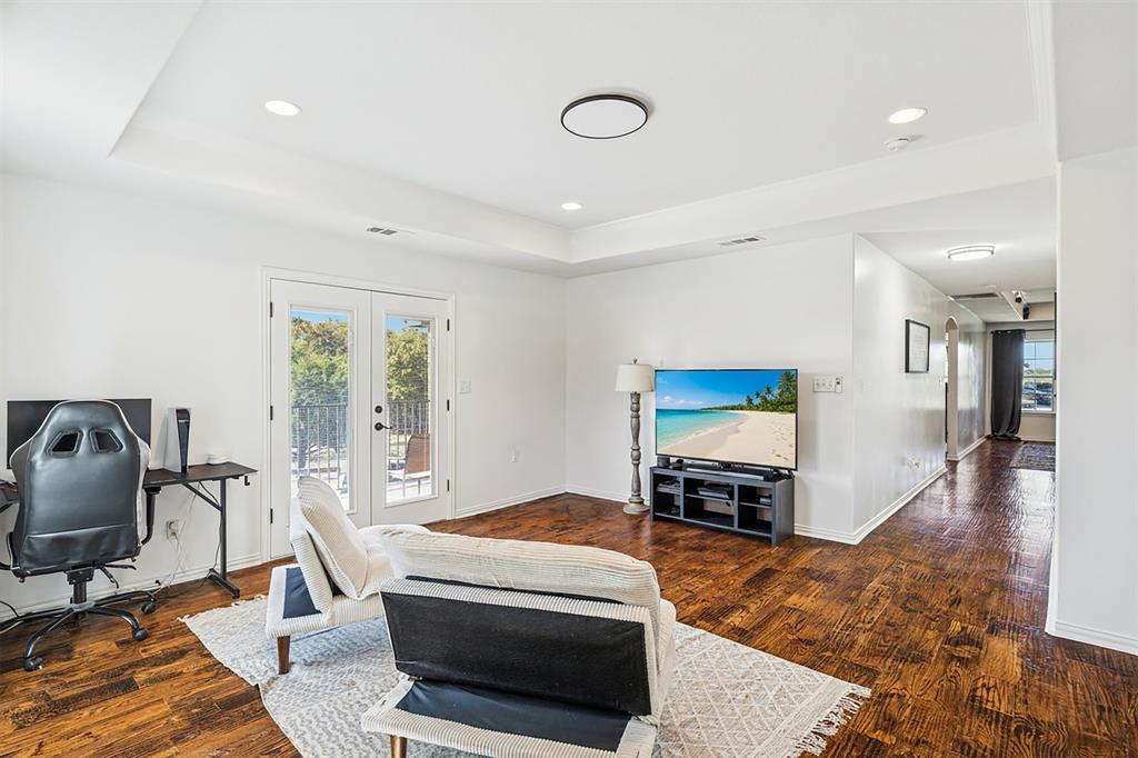 3390 Zion Hill Road Weatherford, TX 76088 - Photo 31 of 40 a living room with furniture and a flat screen tv