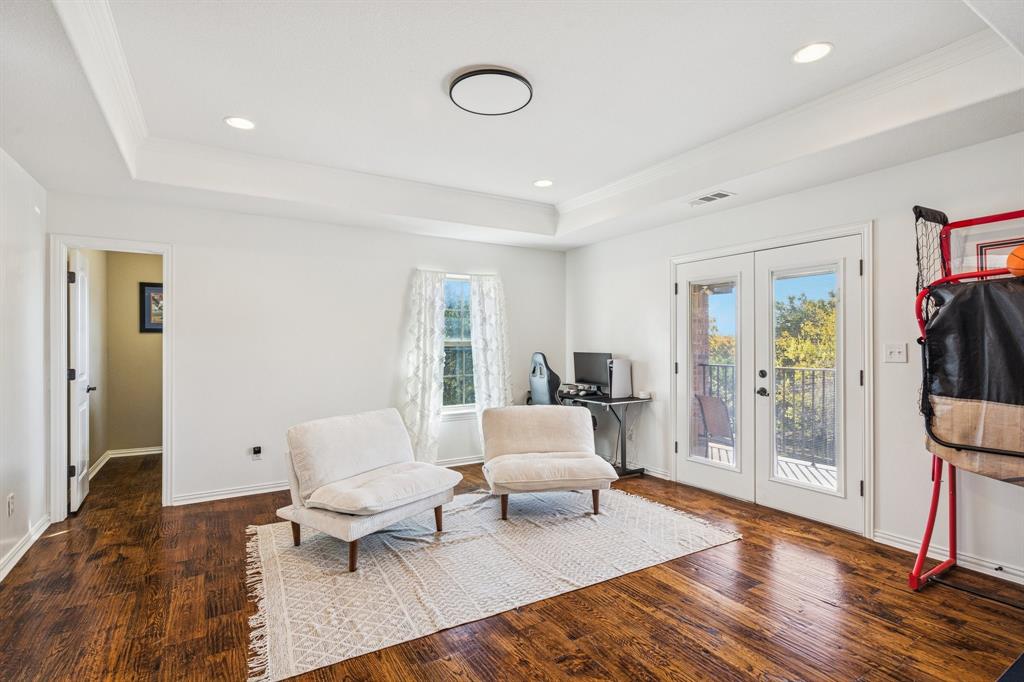 3390 Zion Hill Road Weatherford, TX 76088 - Photo 32 of 40 a living room with furniture and wooden floor