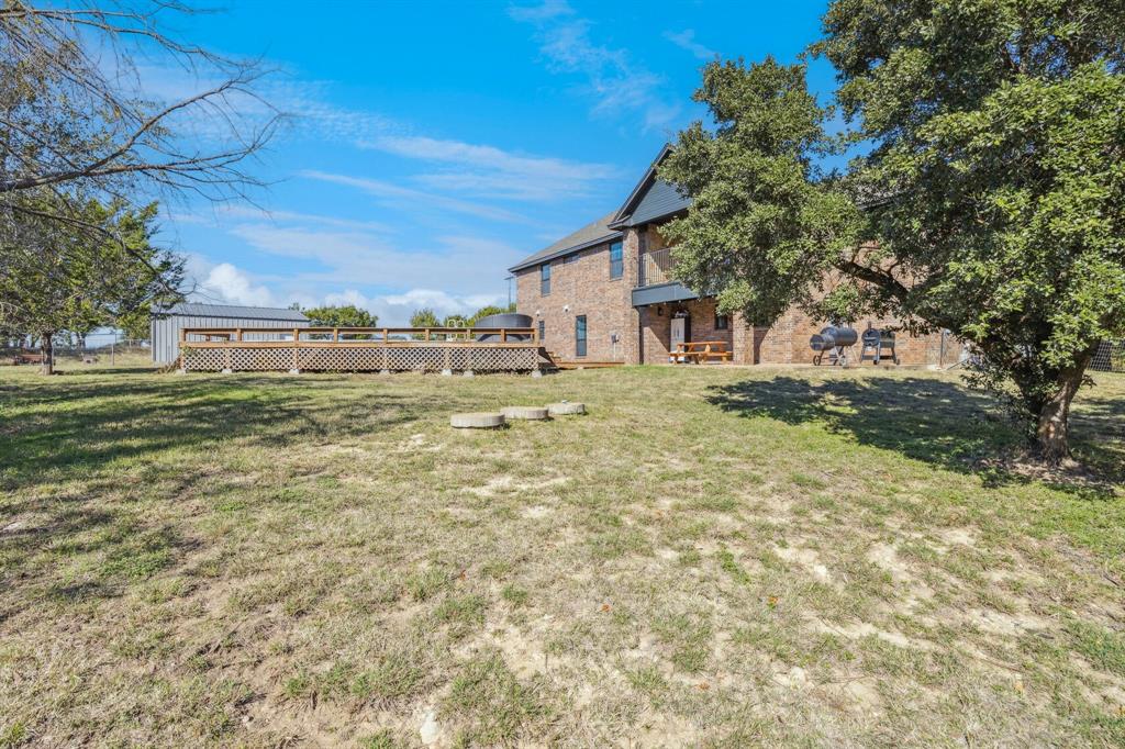 3390 Zion Hill Road Weatherford, TX 76088 - Photo 37 of 40 a house view with a outdoor space