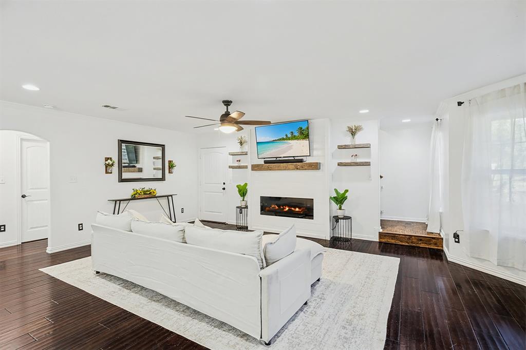 3390 Zion Hill Road Weatherford, TX 76088 - Photo 4 of 40 a living room with furniture and a fireplace