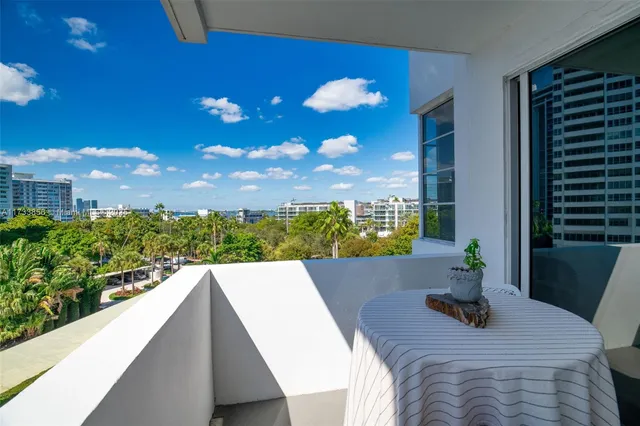 a view of balcony with furniture