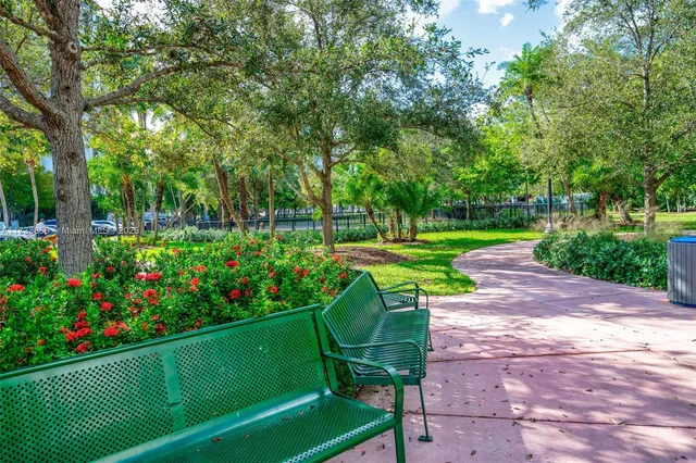 a view of a table and chairs in the garden
