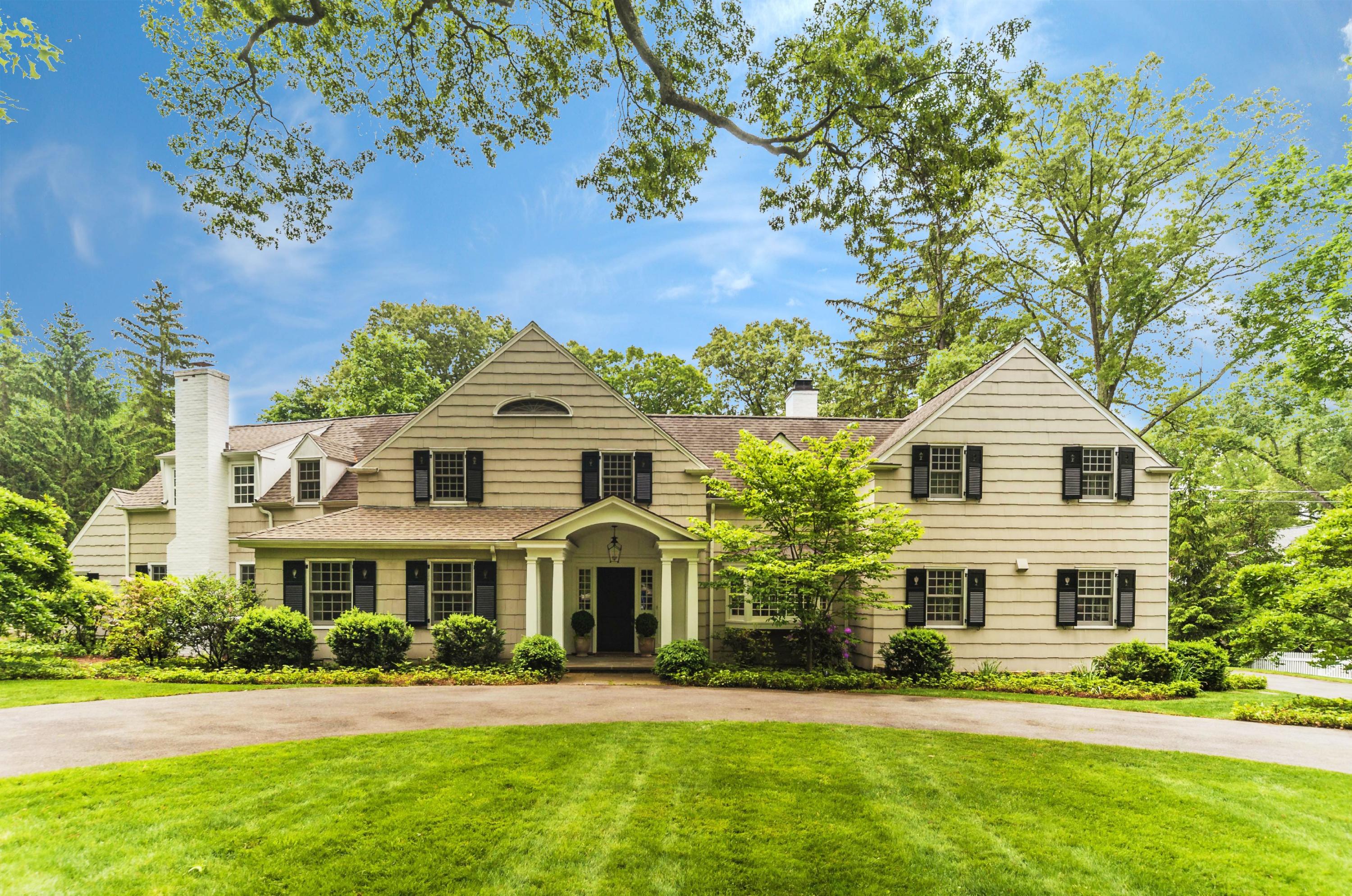 4 Point O Woods Road Darien, CT 06820 - Photo 1 of 23 a front view of a residential houses with yard and green space
