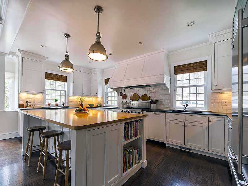 4 Point O Woods Road Darien, CT 06820 - Photo 5 of 23 a kitchen with stainless steel appliances granite countertop a sink a stove and a wooden floors