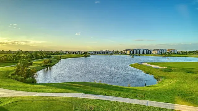 a kitchen with granite countertop white cabinets and stainless steel appliances