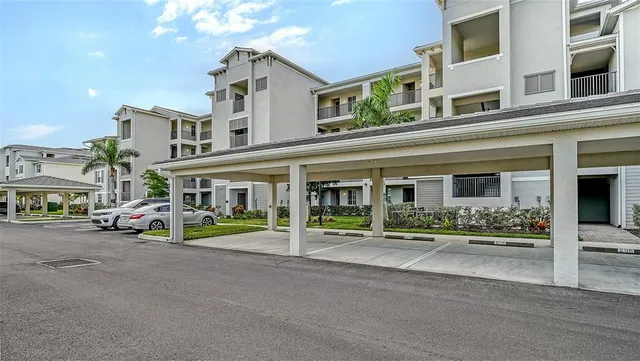 a view of a hallway with workspace and a couch
