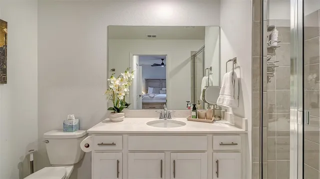 a view of a lake with houses in the back