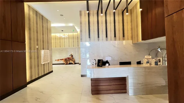 a kitchen with stainless steel appliances a stove and cabinets