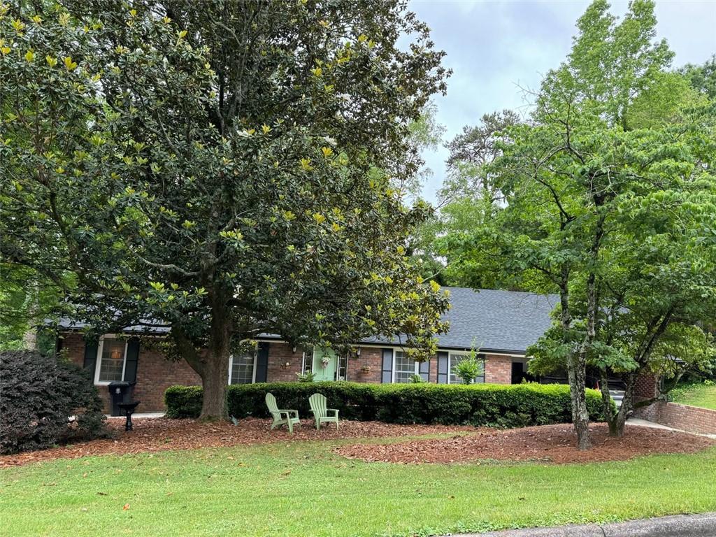 28 Riverview Road Southeast Rome, GA 30161 - Photo 1 of 1 a backyard of a house with seating space