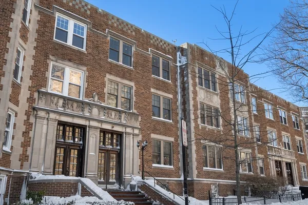 a front view of a building with glass windows