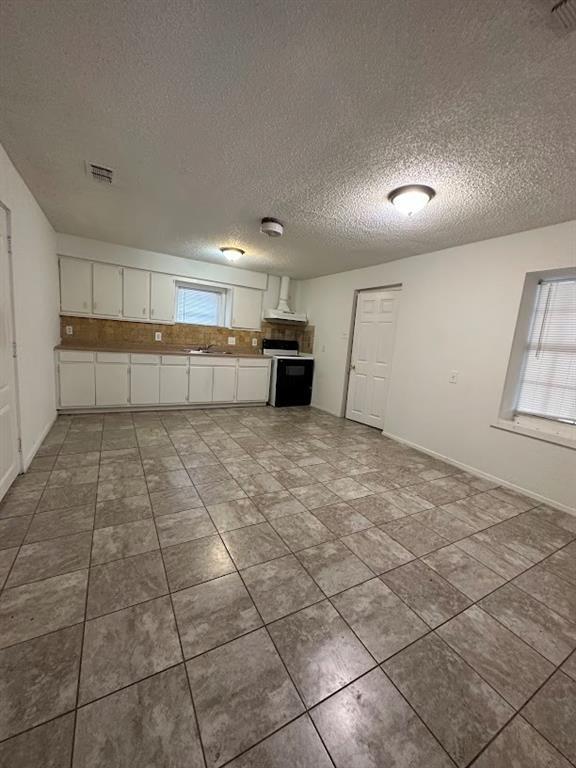 1148 1/2 Gunter Street, Unit A Austin, TX 78721 - Photo 10 of 10 a view of a kitchen with a sink and a window
