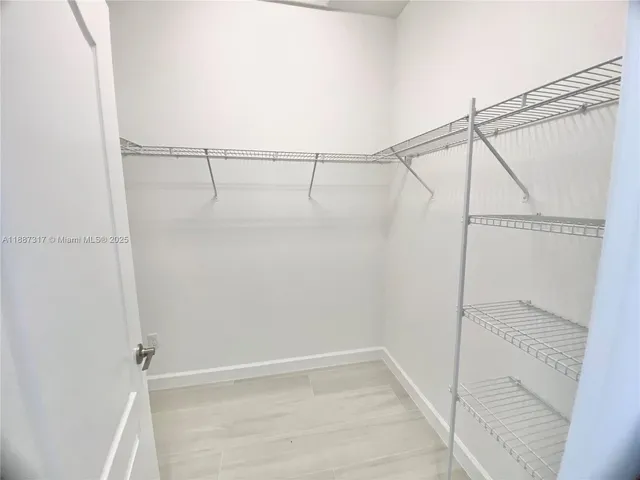 a view of an empty walk in closet