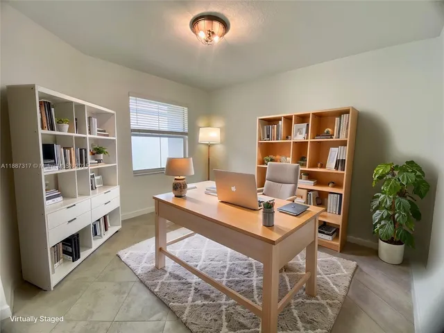 a workspace with furniture and window