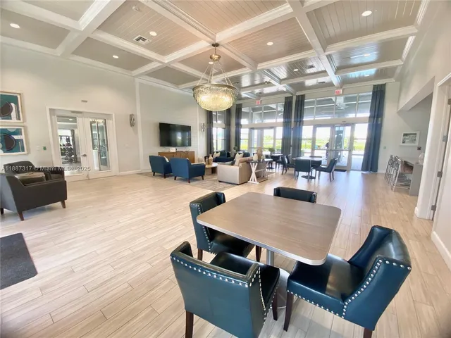 a view of kitchen island wooden floor cabinets and outdoor space