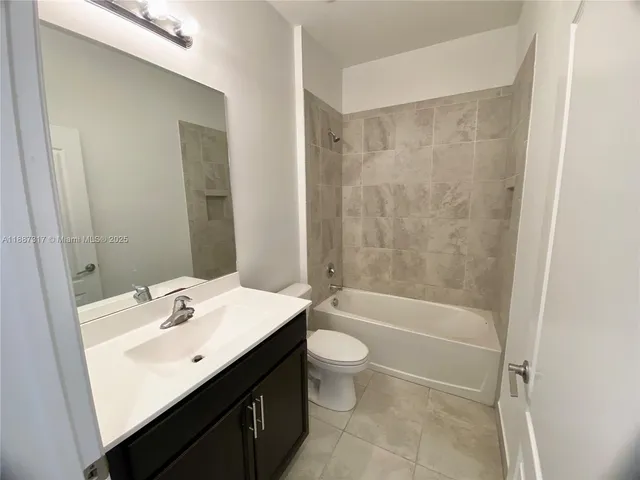 a view of a hallway with a white door