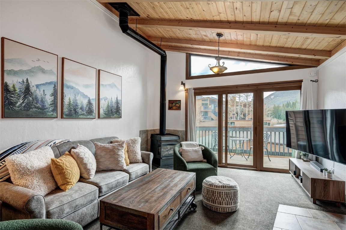 1473 East Keystone Road, Unit 2933 Keystone, CO 80435 - Photo 1 of 18 a living room with furniture a flat screen tv and a large window