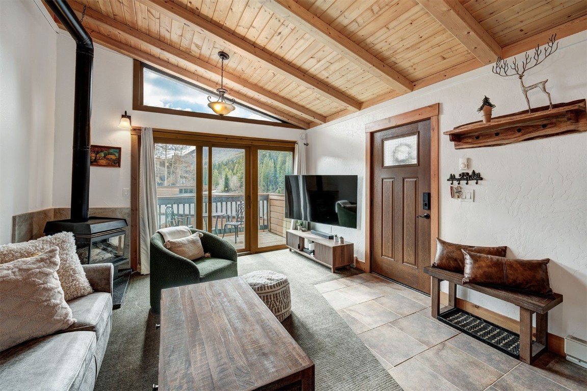 1473 East Keystone Road, Unit 2933 Keystone, CO 80435 - Photo 2 of 18 a living room with furniture a flat screen tv and a large window