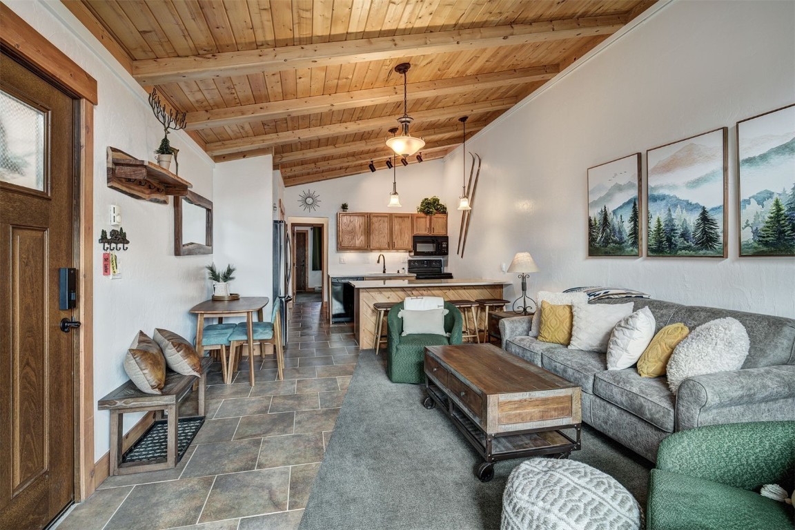 1473 East Keystone Road, Unit 2933 Keystone, CO 80435 - Photo 3 of 18 a living room with lots of furniture and kitchen view