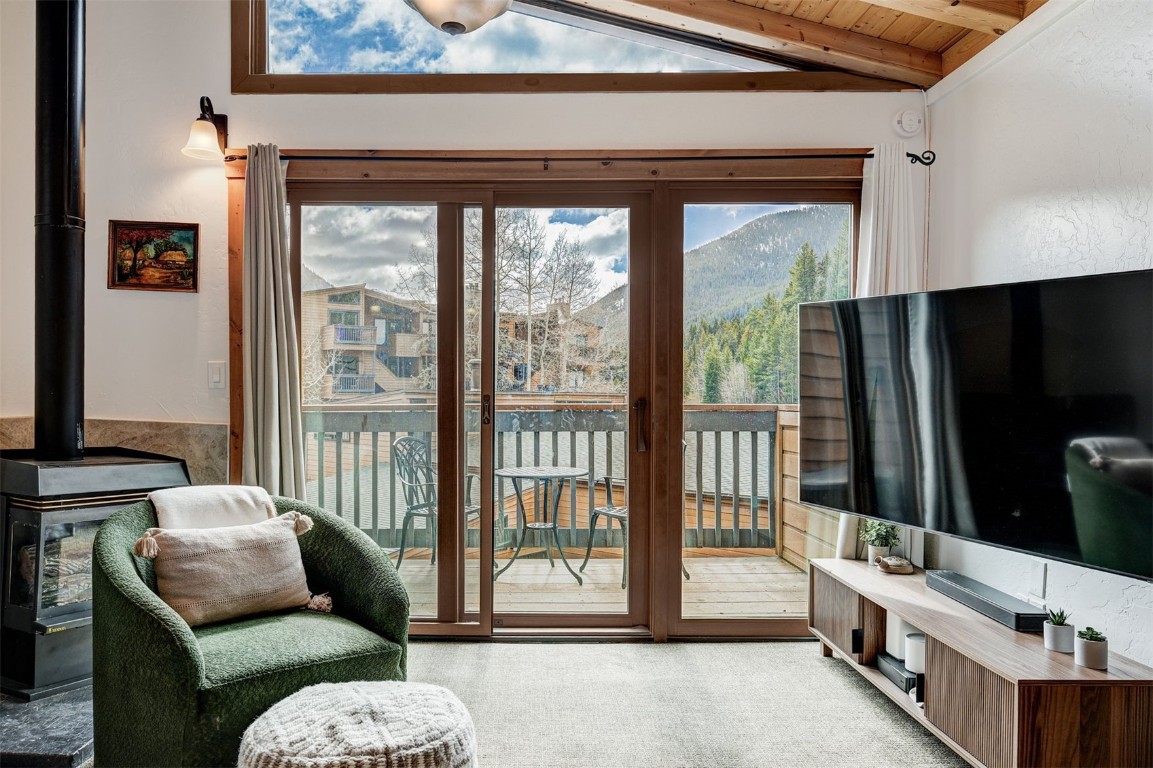 1473 East Keystone Road, Unit 2933 Keystone, CO 80435 - Photo 5 of 18 a living room with furniture and a floor to ceiling window