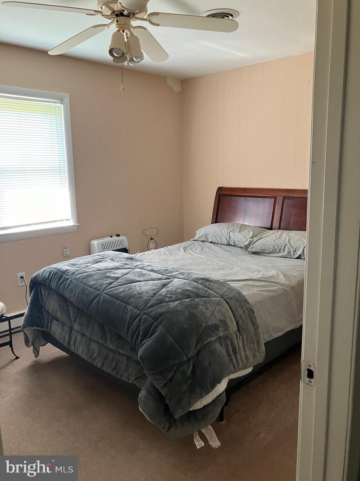 209 Olive Branch Road Stevensville, MD 21666 - Photo 16 of 19 a bedroom with a bed and window