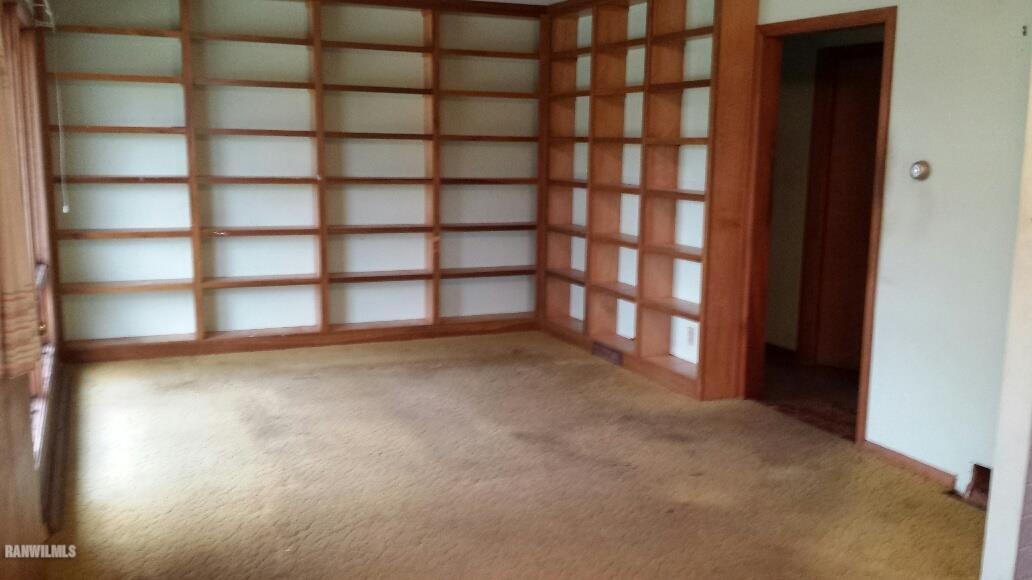 305 East State Road Mount Carroll, IL 61053 - Photo 4 of 10 a view of an empty room with a window