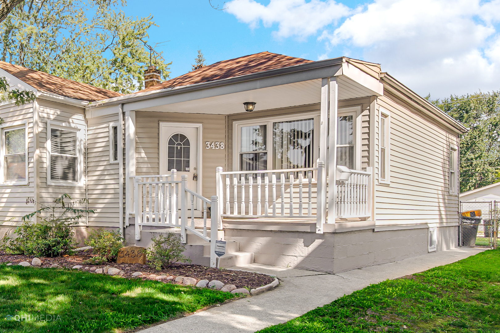 3438 Randolph Street Lansing, IL 60438 - Photo 1 of 23 a front view of a house with a yard