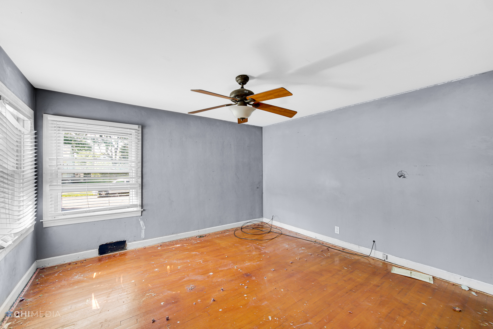 3438 Randolph Street Lansing, IL 60438 - Photo 18 of 23 wooden floor in an empty room with a window