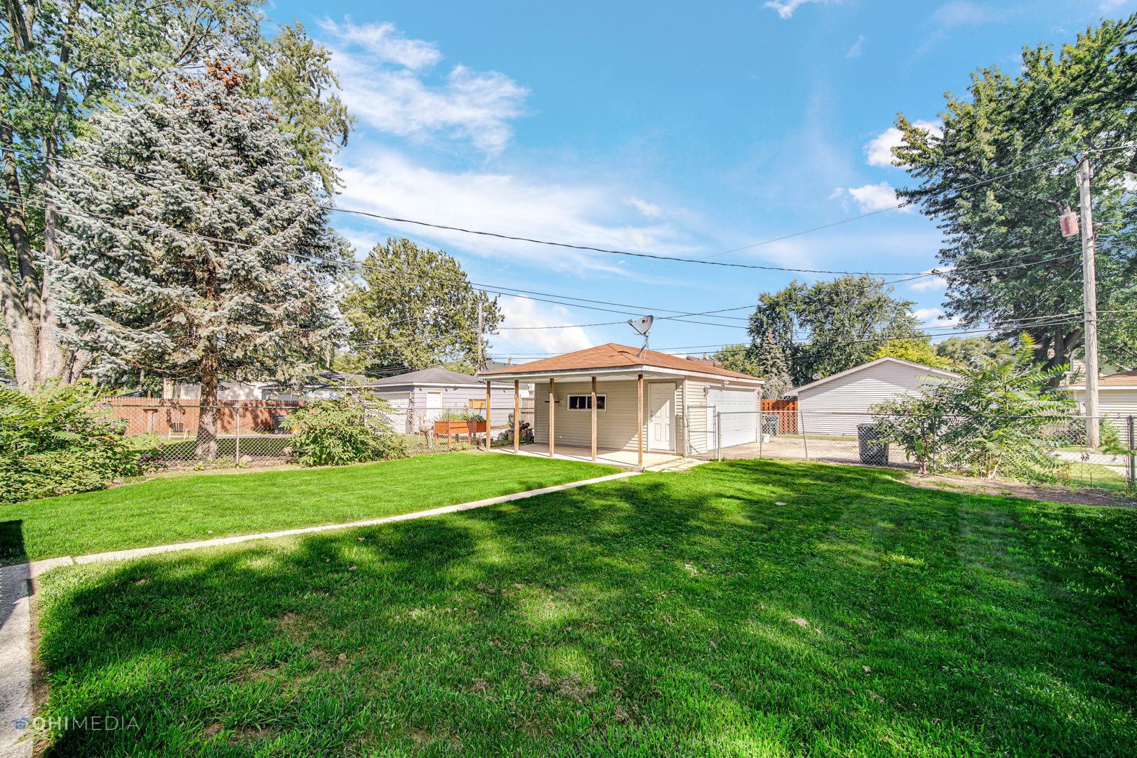 3438 Randolph Street Lansing, IL 60438 - Photo 4 of 23 a view of a big yard with a house in the background