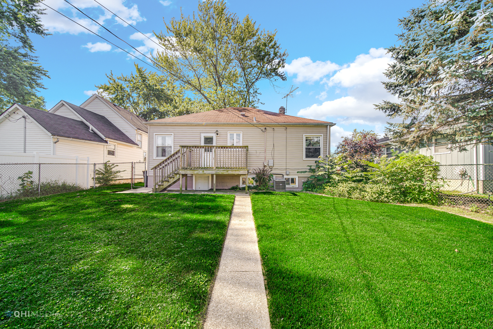 3438 Randolph Street Lansing, IL 60438 - Photo 5 of 23 a view of a house with yard and a garden