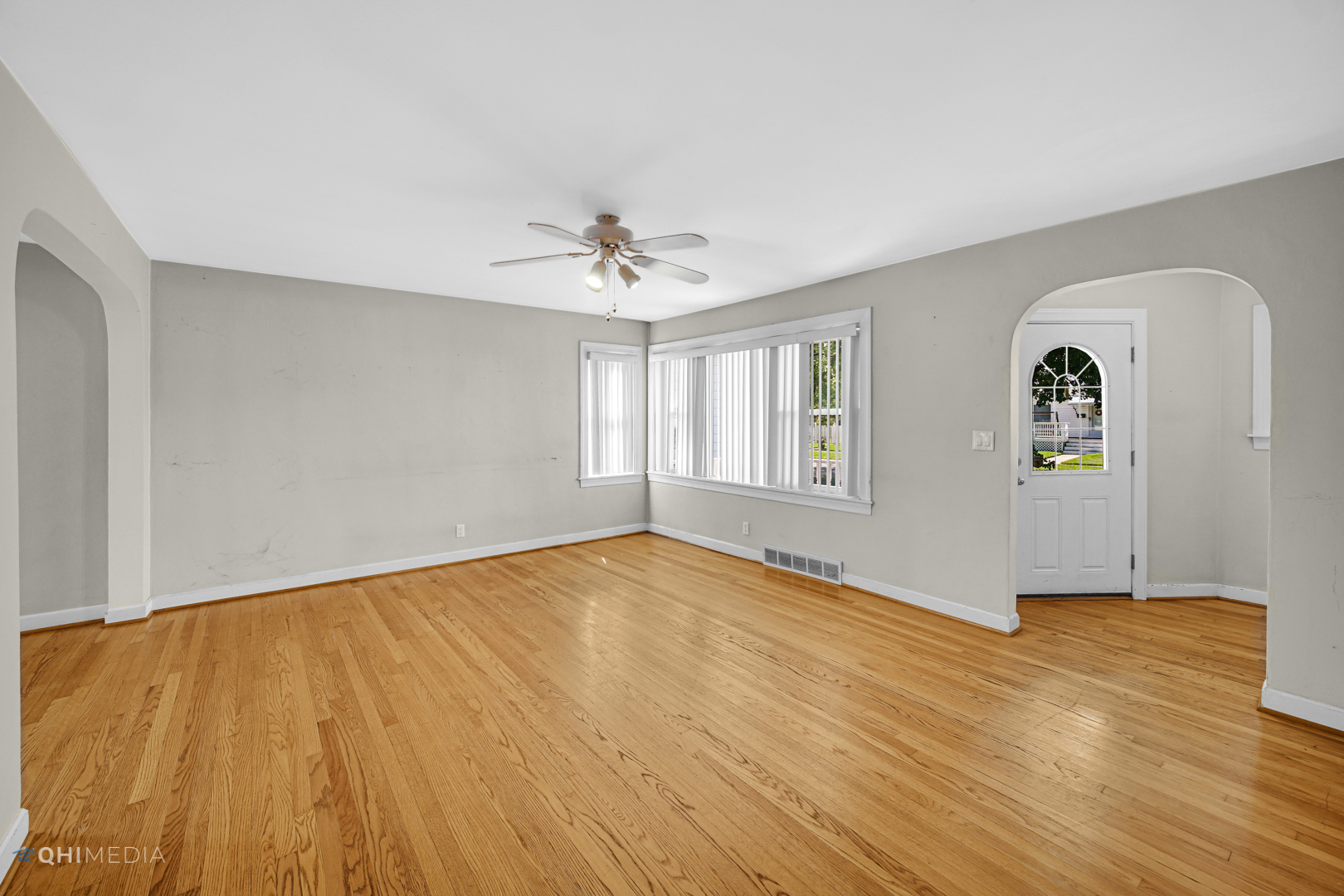 3438 Randolph Street Lansing, IL 60438 - Photo 8 of 23 a view of an empty room with window and wooden floor