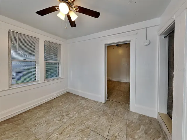 a view of an empty room with a window