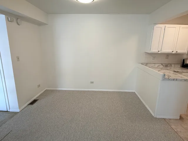 a view of a kitchen with a sink