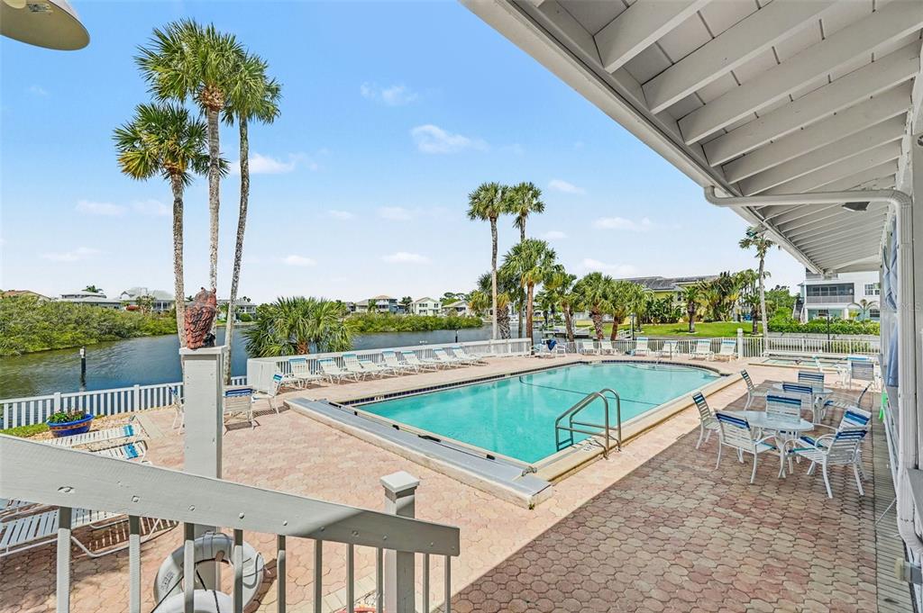 5567 Sea Forest Drive, Unit 324 New Port Richey, FL 34652 - Photo 23 of 23 a view of a swimming pool with a patio