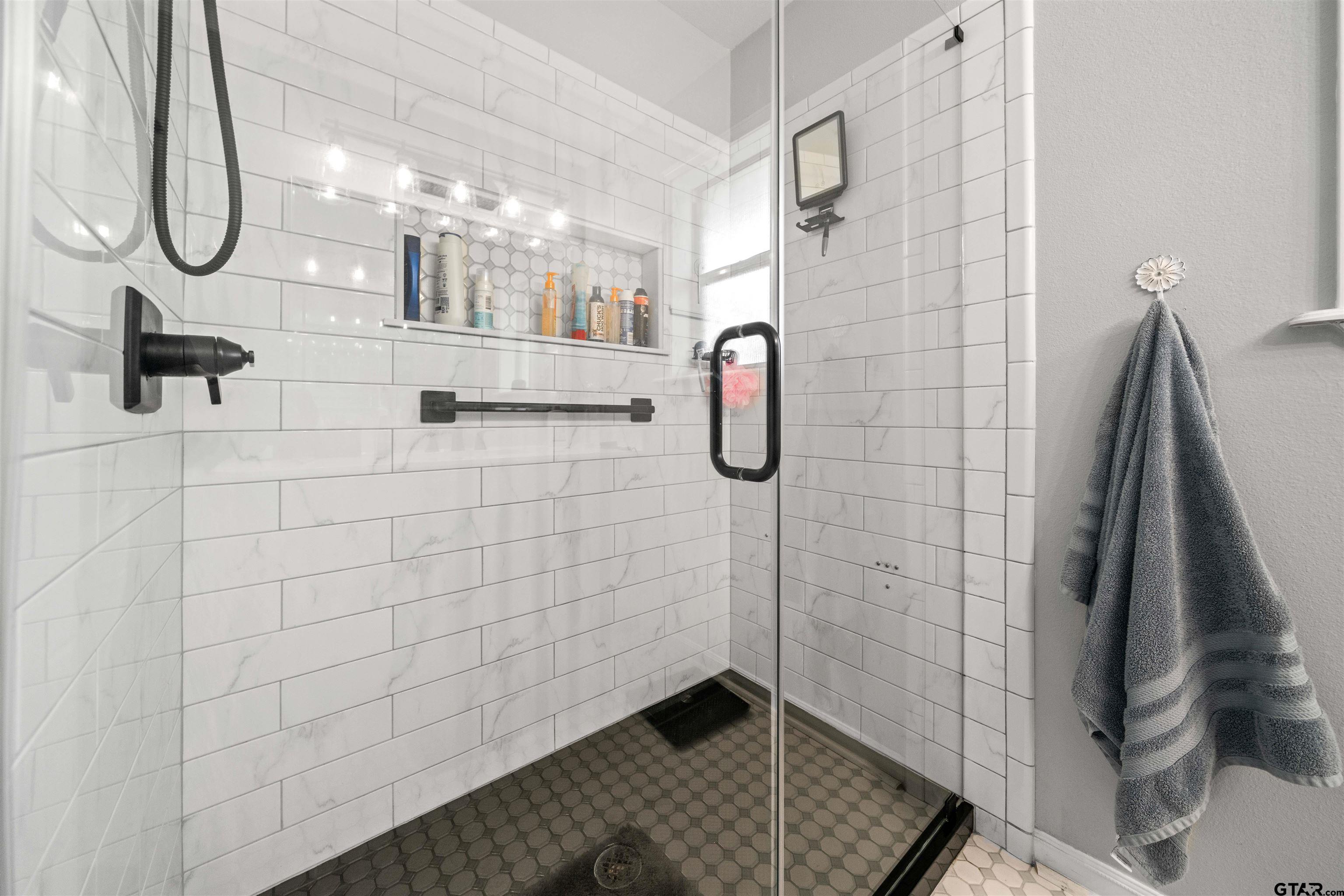 1521 Rice Road, Unit A105 Tyler, TX 75703 - Photo 22 of 28 a bathroom with a shower