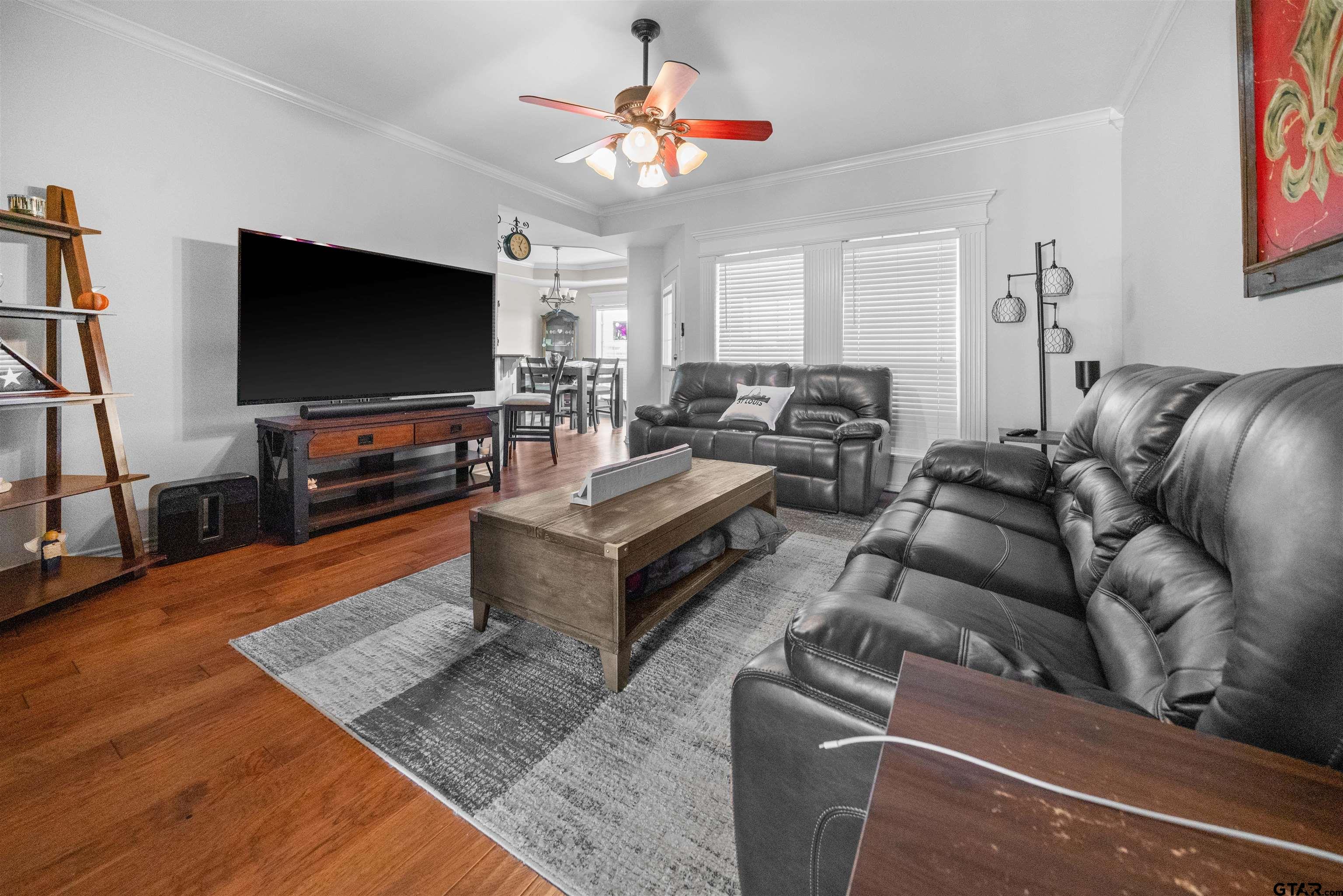 1521 Rice Road, Unit A105 Tyler, TX 75703 - Photo 5 of 28 a living room with furniture and a flat screen tv
