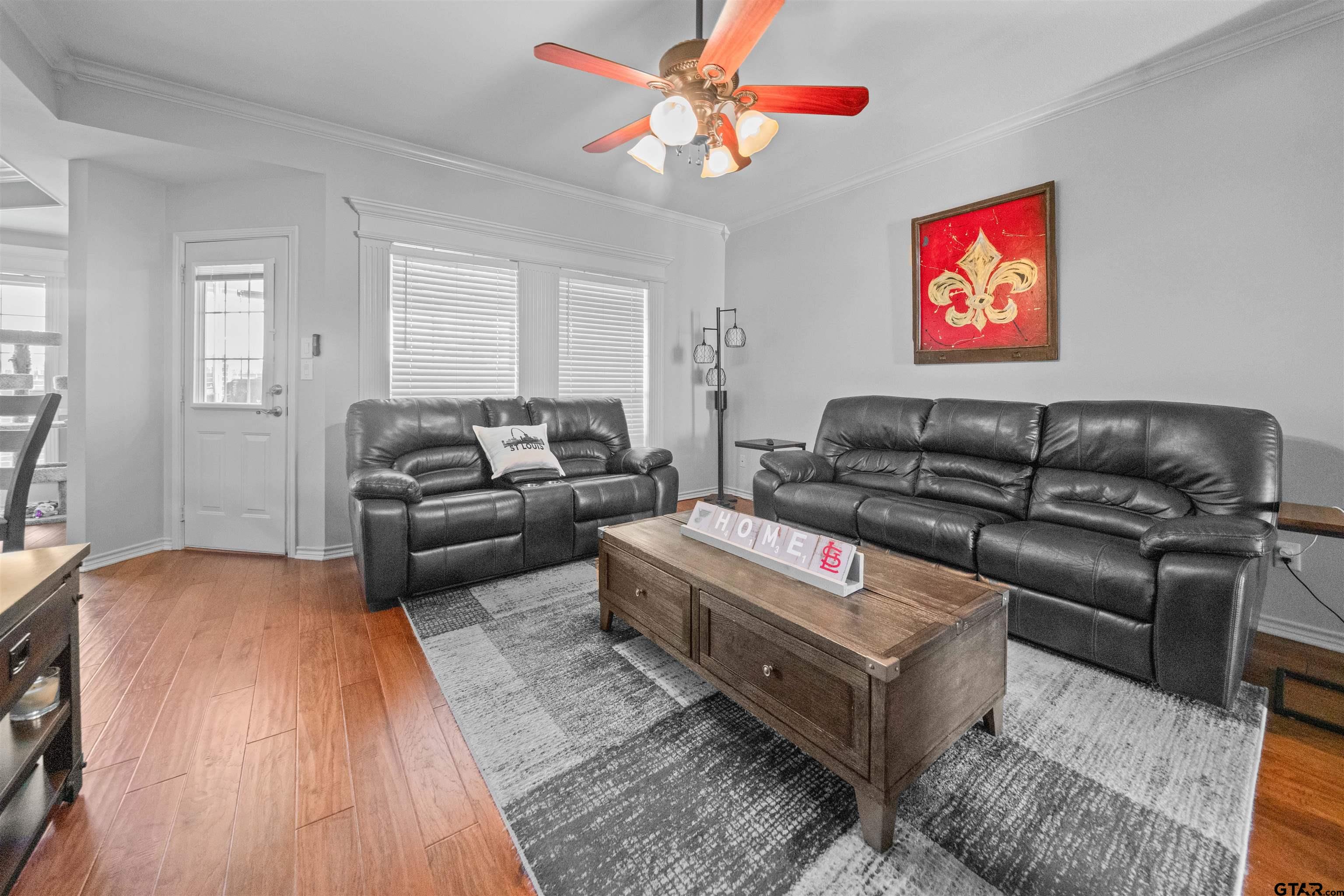 1521 Rice Road, Unit A105 Tyler, TX 75703 - Photo 6 of 28 a living room with furniture or couch and a chandelier