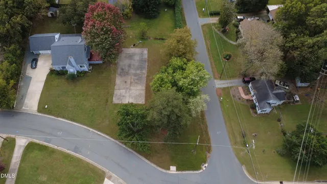 an aerial view of a house with outdoor space