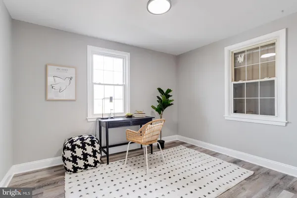 a living room with a couch and a window
