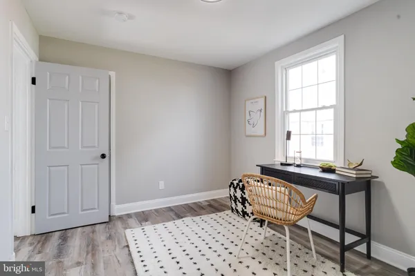 a living room with a couch and a window
