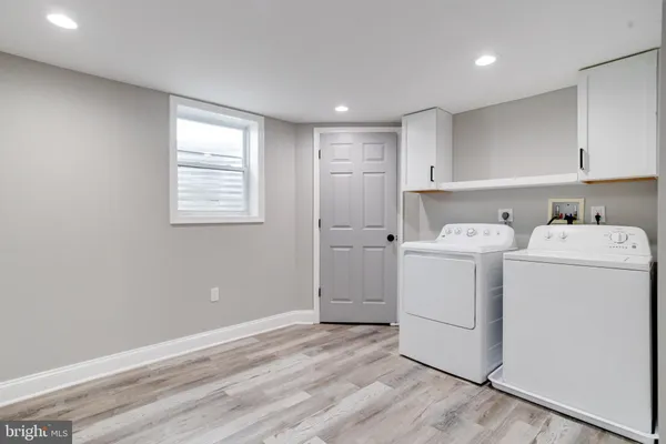 a view of a storage & utility room with washer and dryer