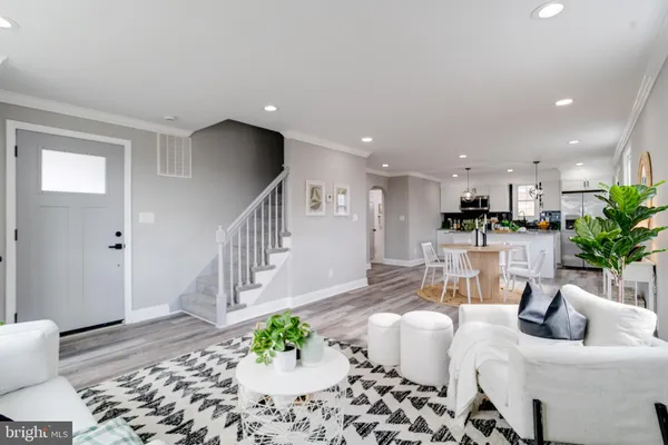 a living room with furniture and a table