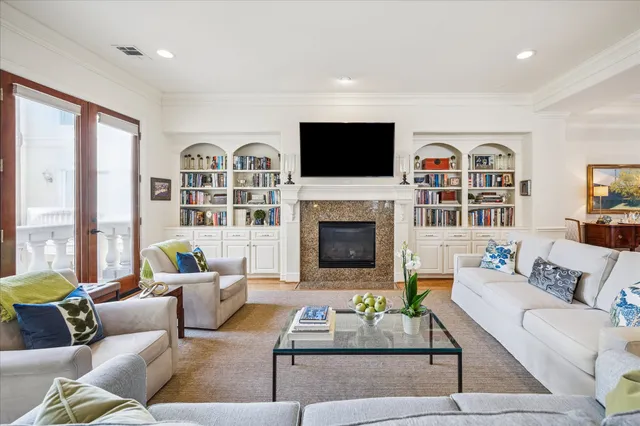 a living room with furniture fireplace and a flat screen tv