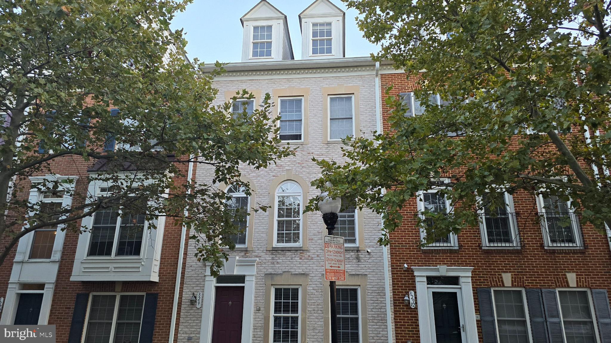 829 McHenry Street Baltimore, MD 21230 - Photo 1 of 17 front view of house with a tree