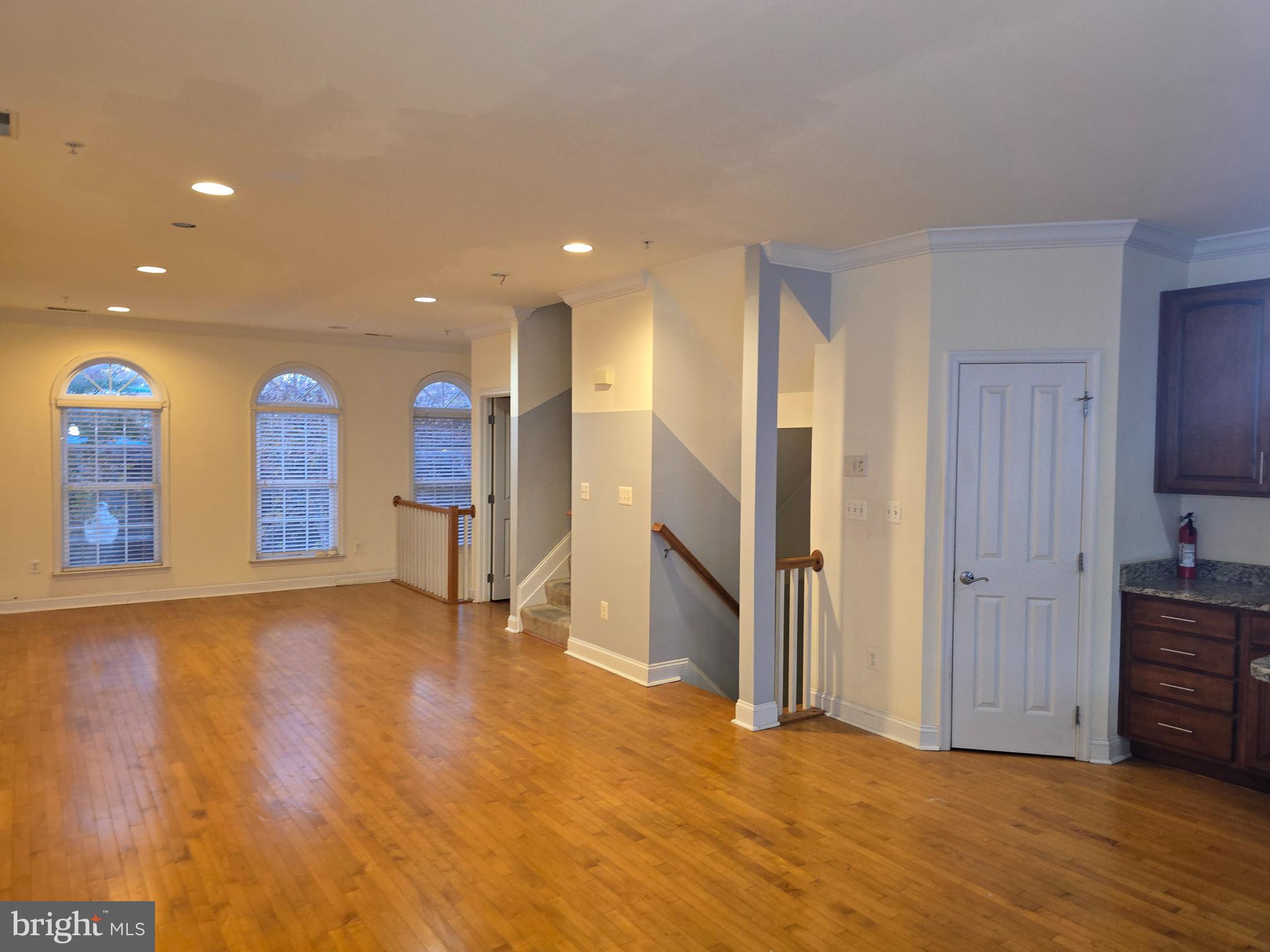 829 McHenry Street Baltimore, MD 21230 - Photo 3 of 17 a view of empty room with wooden floor and cabinet