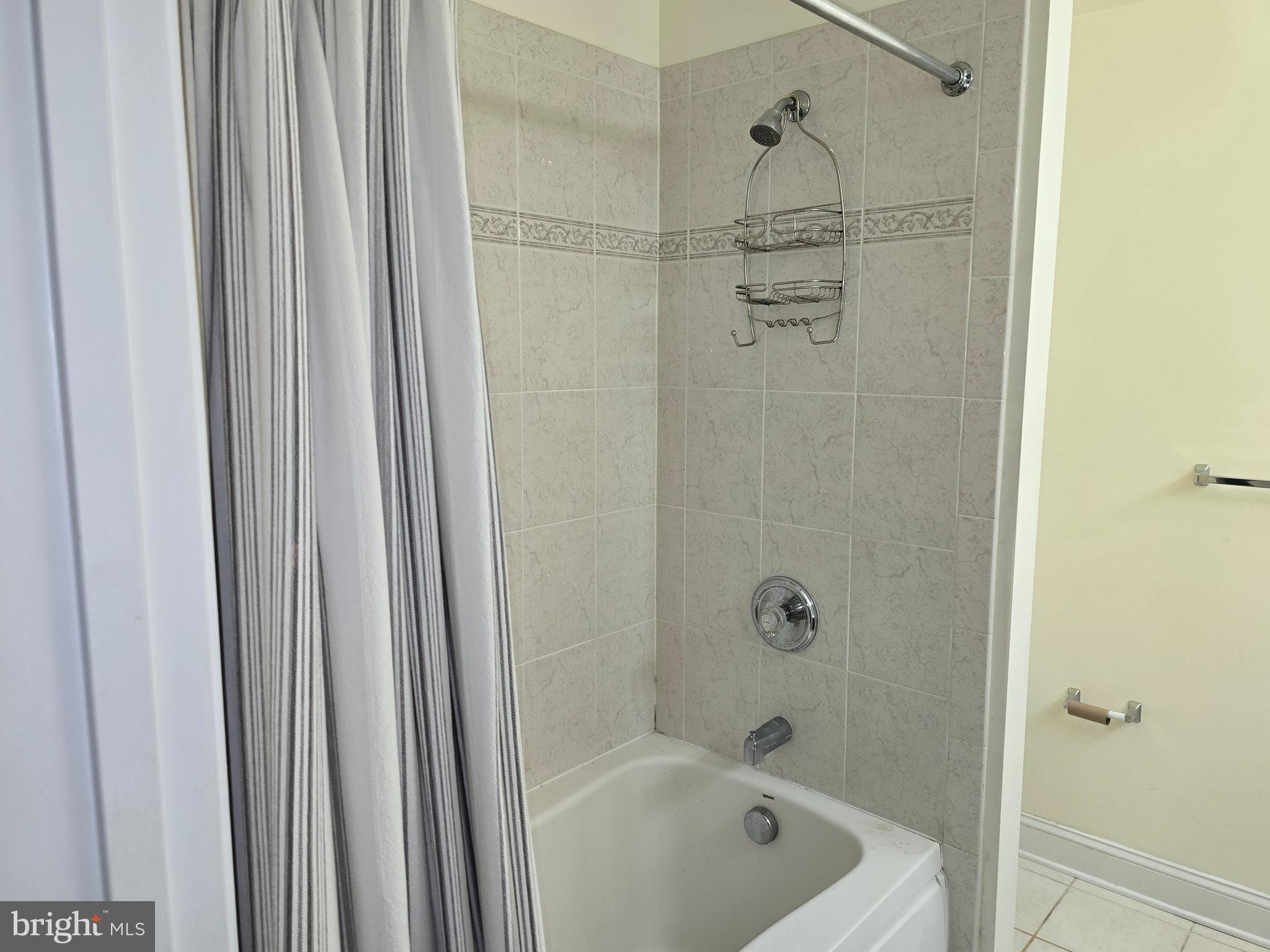 829 McHenry Street Baltimore, MD 21230 - Photo 10 of 17 a bathroom with a tub and shower