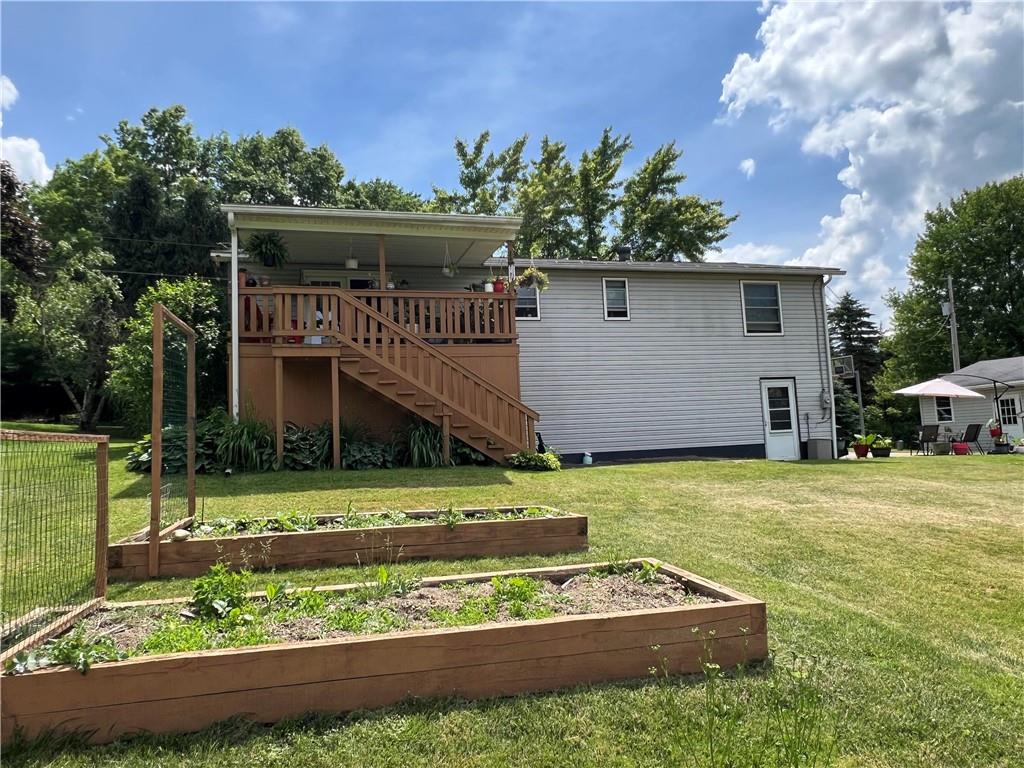 97 Rinkus Drive Indiana, PA 15701 - Photo 25 of 48 a front view of a house with a garden and plants