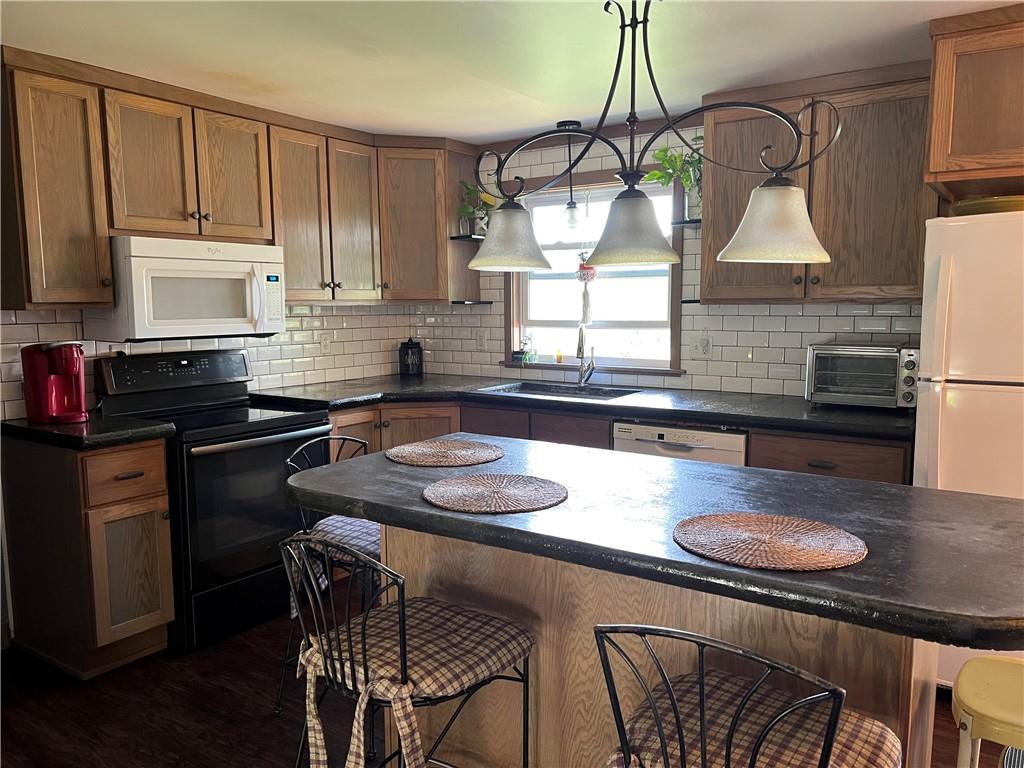 97 Rinkus Drive Indiana, PA 15701 - Photo 3 of 48 a kitchen with a table chairs stove and cabinets