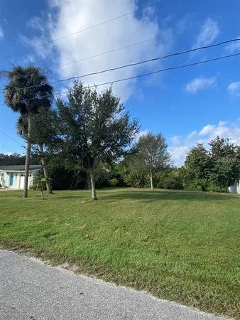 a view of a field with an trees